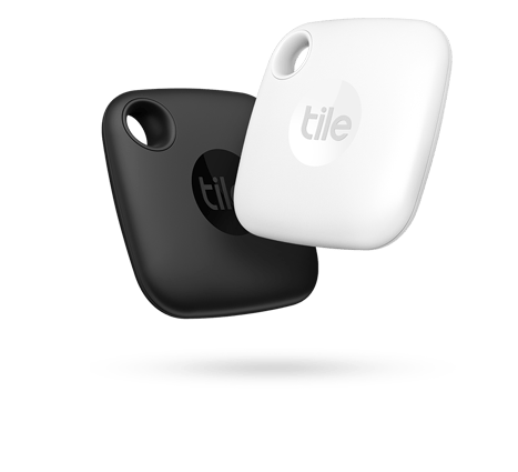 Black and white Tile tracking devices floating, showcasing their sleek design for locating lost items easily. Ideal for enhancing personal organization.